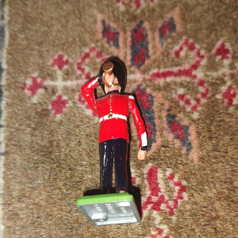 Red and Black Toy Soldier Figurine